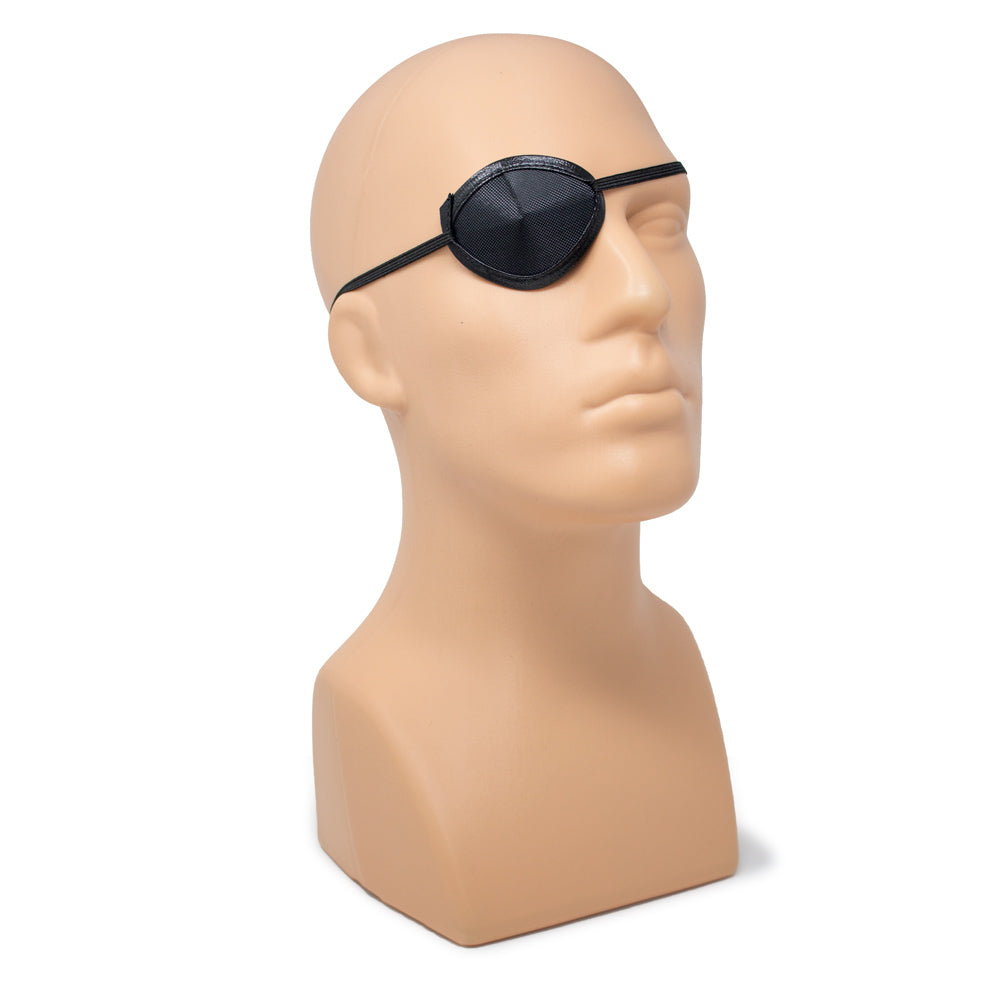 A black eye patch with an elastic strap displayed on a beige mannequin head against a white background.