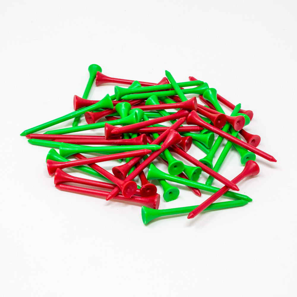 A pile of plastic golf tees in bright red and green, scattered on a plain white background.