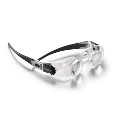 Eschenbach MaxDETAIL magnifying glasses with clear transparent lenses, a black and silver temple arm, and a clear nose bridge, shown on a white background with a soft shadow.