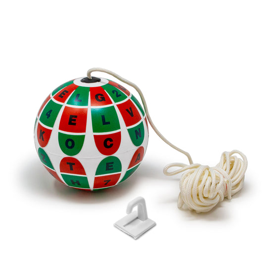A soft white marsden ball with a white cord and white wall hook, featuring a pattern of red and green panels with black letters and numbers, on a white background.