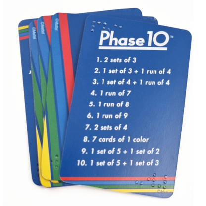 A stack of blue Phase 10 card games on a white background, showing the front card with white text and colorful striped edges.