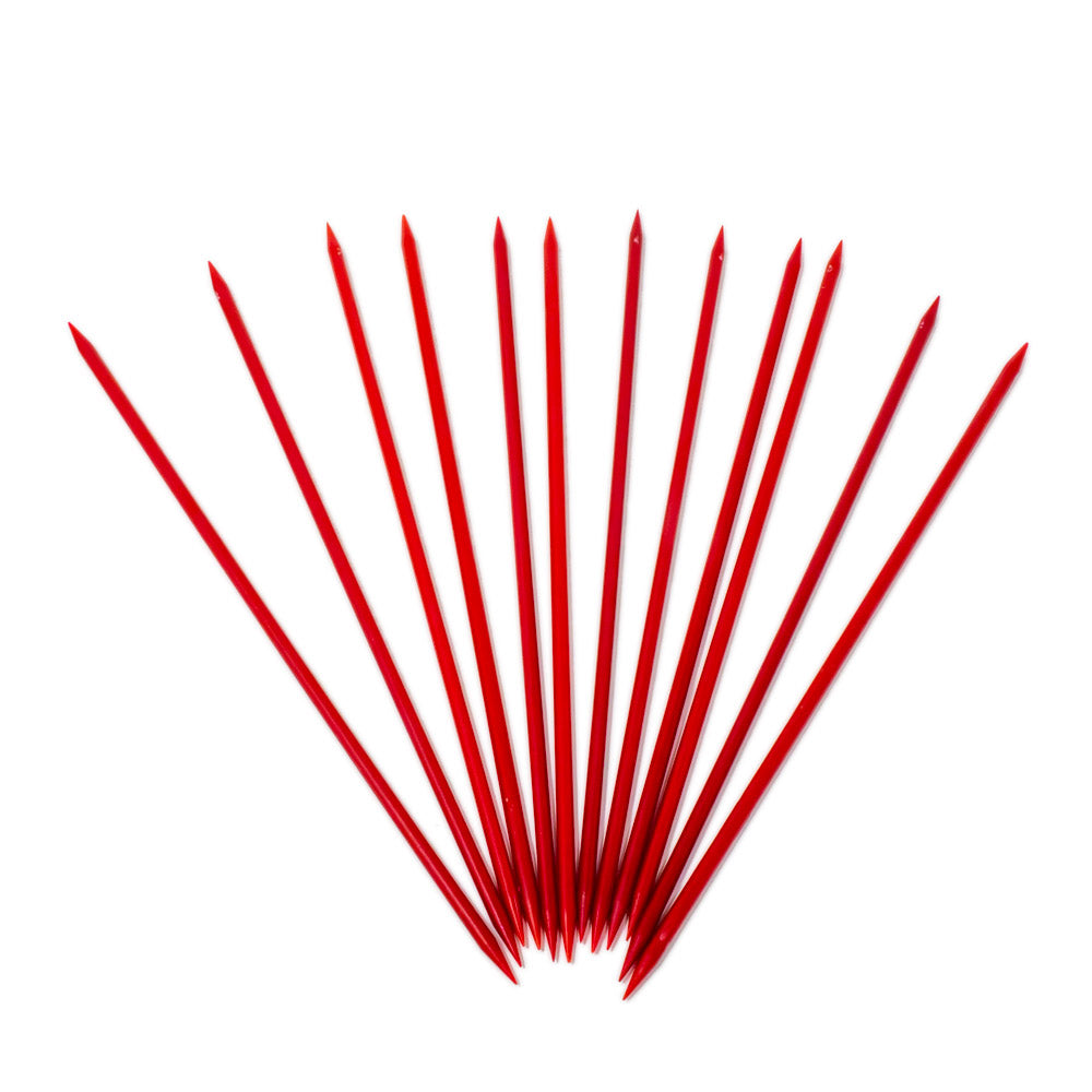 Plastic pointers spread across a white background