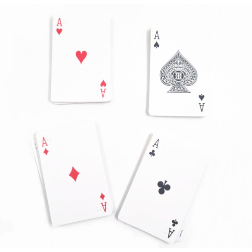 Four Ace playing cards arranged on a plain white background, showing hearts, spades, diamonds, and clubs faces, with Braille print on each card.