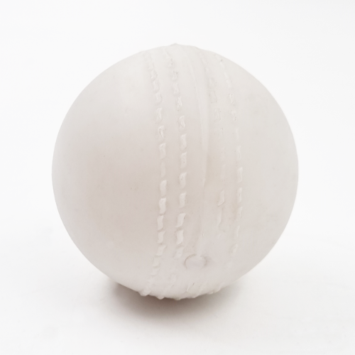A white plastic cricket ball with visible stitched seams, photographed against a seamless white background.