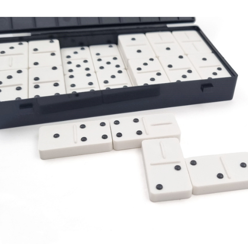 White domino tiles with black raised pips shown with a black plastic storage case on a white background.